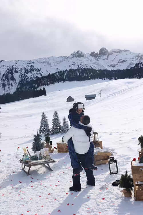 She leaps into his arms after the yes, on the snowfield